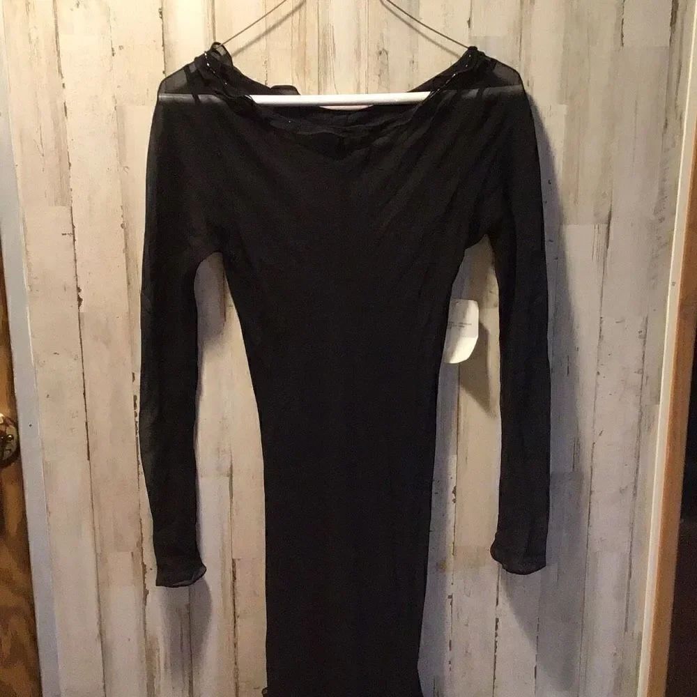 Gown sheer black with gold trim and flower at the bottom by Exyla size 4 new wit